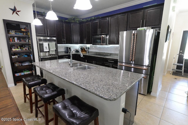 1757 Attilburgh Blvd, Melbourne, FL 32904 - kitchen featuring stainless steel appliances, light tile patterned flooring, crown molding, light stone counters, and a breakfast bar area