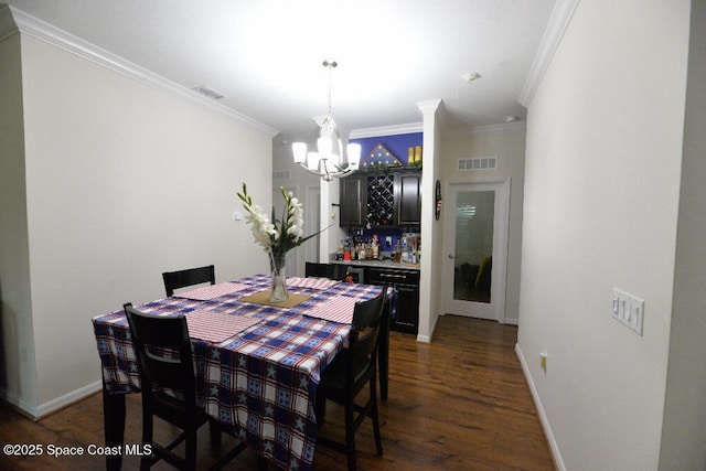 1757 Attilburgh Blvd, Melbourne, FL 32904 - dining space with a chandelier, ornamental molding, and dark wood-type flooring