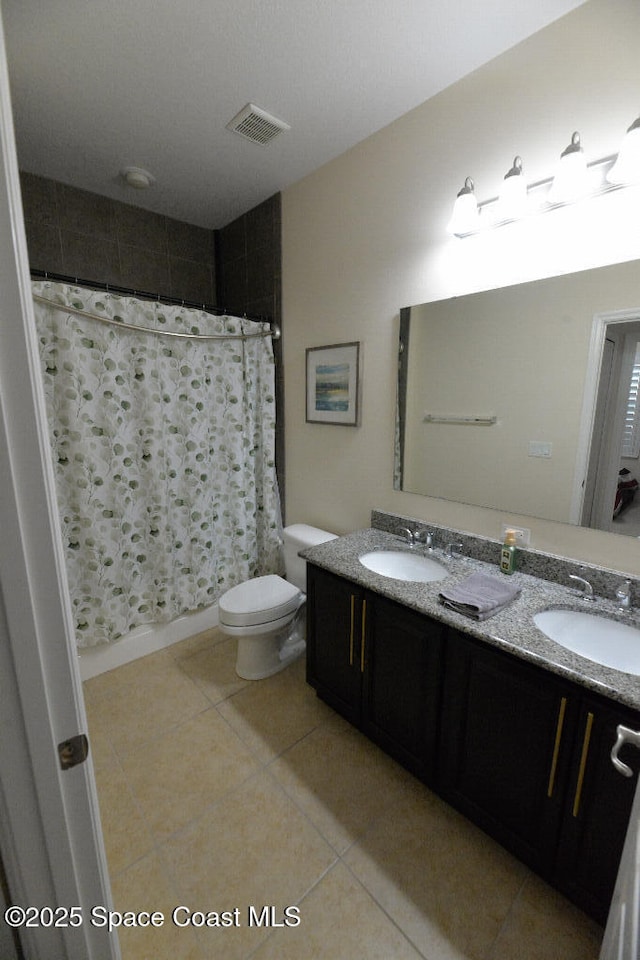 1757 Attilburgh Blvd, Melbourne, FL 32904 - full bathroom featuring double vanity, tile patterned floors, and a shower with shower curtain