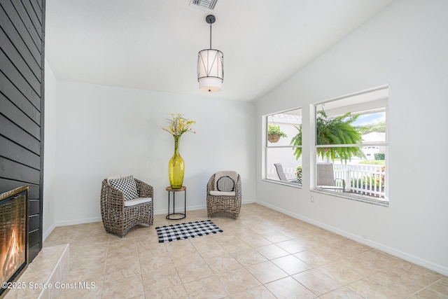 914 S Fork Cir, Melbourne, FL 32901 - sitting room with a large fireplace, lofted ceiling, and light tile patterned floors
