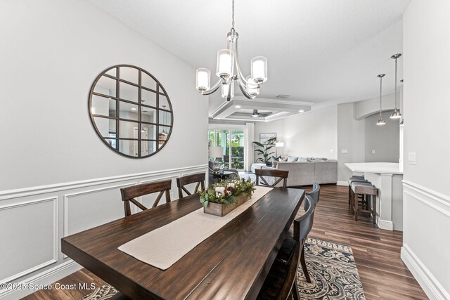 1649 Tullagee Ave, Melbourne, FL 32940 - dining space with a chandelier, wood finished floors, and a wainscoted wall