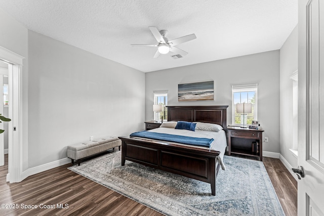 1649 Tullagee Ave, Melbourne, FL 32940 - bedroom with dark wood-style floors, a ceiling fan, and a textured ceiling