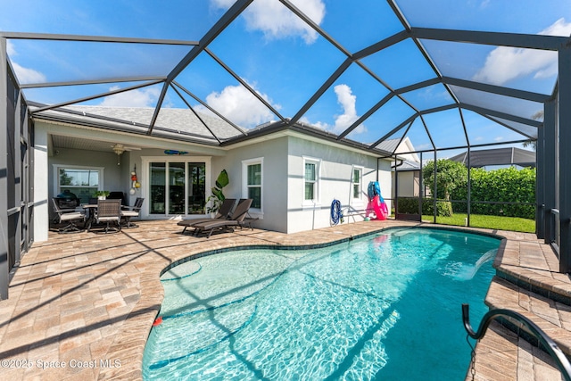 1649 Tullagee Ave, Melbourne, FL 32940 - outdoor pool with a patio area, glass enclosure, and a ceiling fan