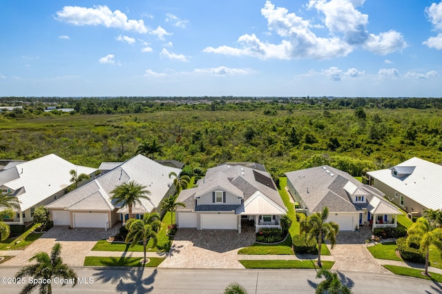 1649 Tullagee Ave, Melbourne, FL 32940 - aerial view of residential area featuring a heavily wooded area
