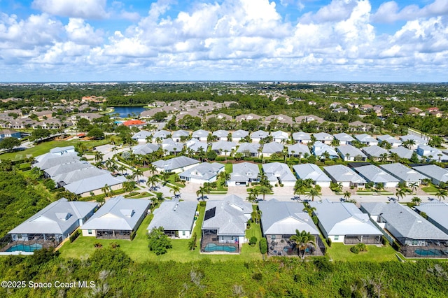 1649 Tullagee Ave, Melbourne, FL 32940 - aerial perspective of suburban area featuring a large body of water