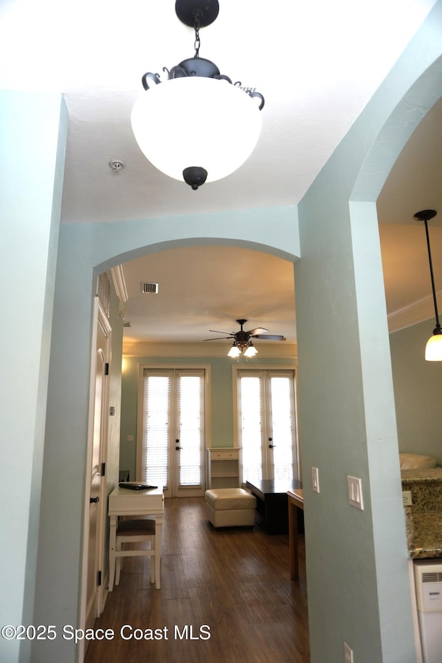 1320 NW 3rd Ave # 238, Gainesville, FL 32608 - hall with french doors, arched walkways, and wood finished floors