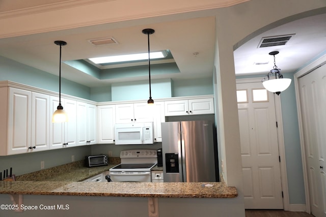 1320 NW 3rd Ave # 238, Gainesville, FL 32608 - kitchen with white appliances, white cabinets, and stone countertops