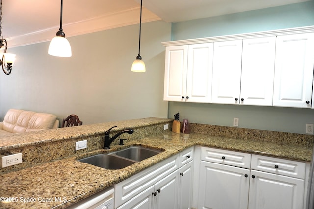1320 NW 3rd Ave # 238, Gainesville, FL 32608 - kitchen featuring ornamental molding, white cabinets, decorative light fixtures, and light stone countertops