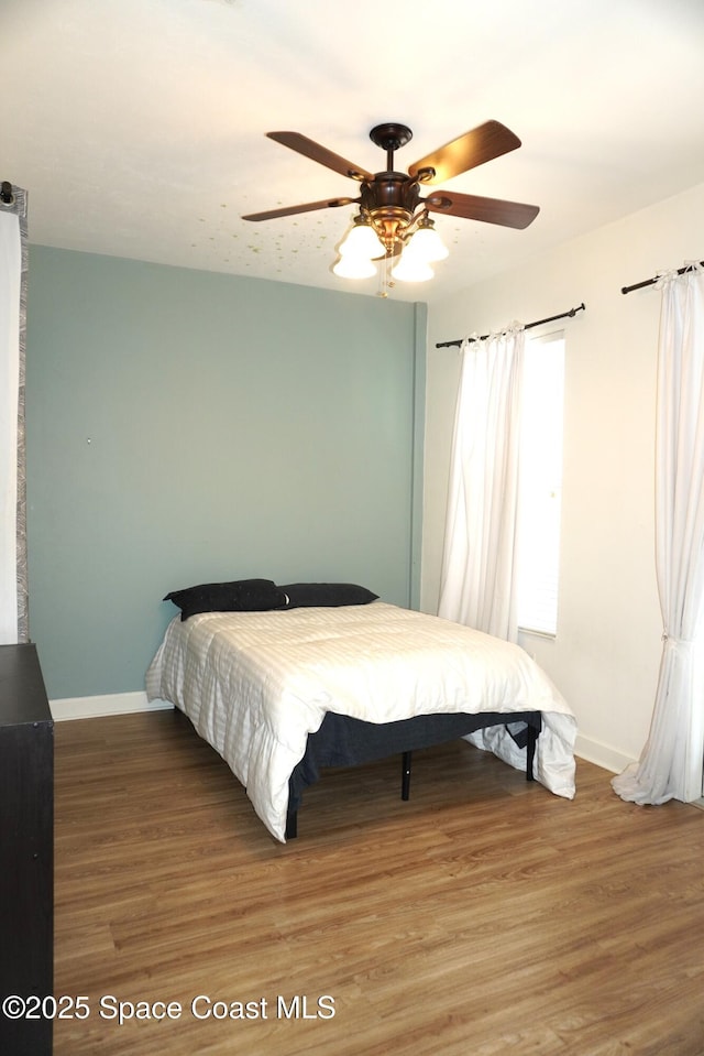 1320 NW 3rd Ave # 238, Gainesville, FL 32608 - bedroom featuring light wood-style flooring and a ceiling fan