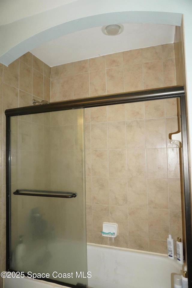 1320 NW 3rd Ave # 238, Gainesville, FL 32608 - full bathroom featuring bath / shower combo with glass door