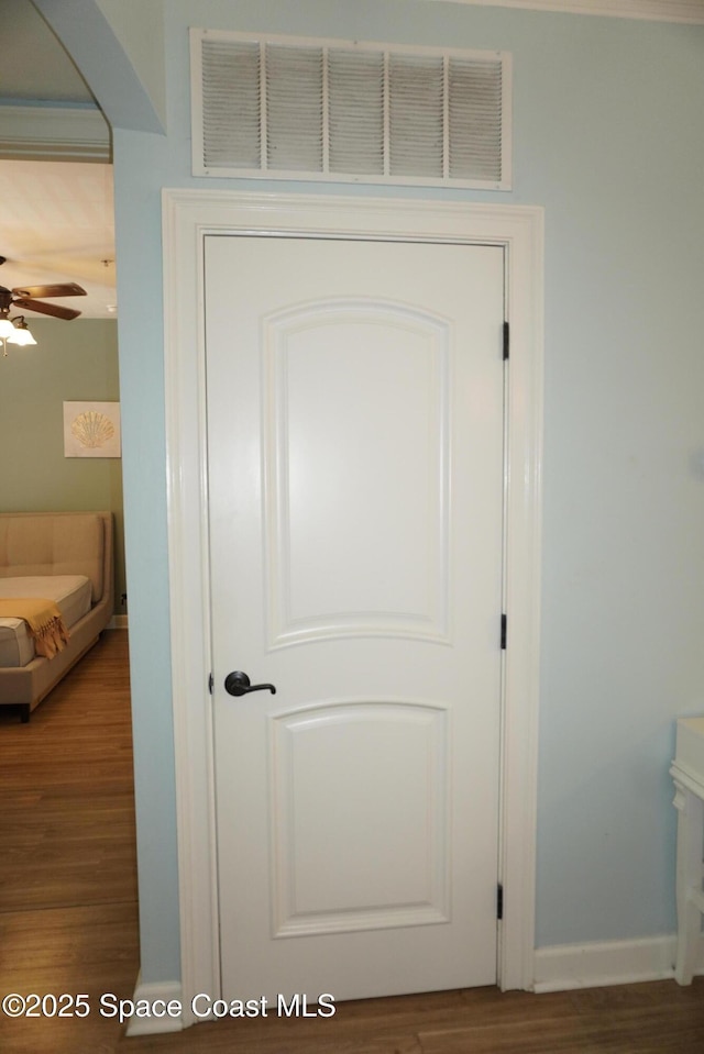 1320 NW 3rd Ave # 238, Gainesville, FL 32608 - detailed view of wood finished floors, a ceiling fan, and arched walkways