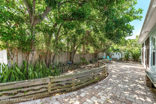 1121 S Orlando Ave, Cocoa Beach, FL 32931 - fenced backyard with a patio