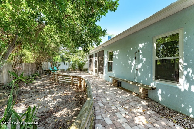 1121 S Orlando Ave, Cocoa Beach, FL 32931 - fenced backyard featuring a patio area