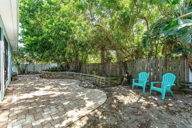 1121 S Orlando Ave, Cocoa Beach, FL 32931 - fenced backyard with a patio area