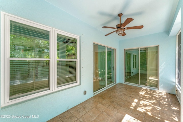 1121 S Orlando Ave, Cocoa Beach, FL 32931 - unfurnished sunroom featuring ceiling fan