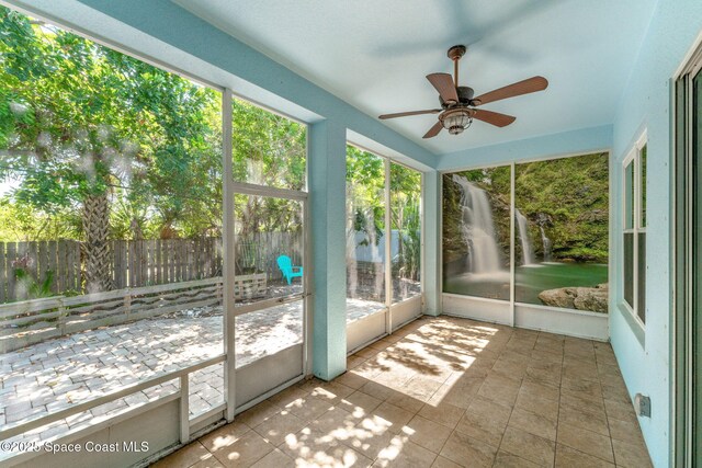 1121 S Orlando Ave, Cocoa Beach, FL 32931 - unfurnished sunroom with ceiling fan