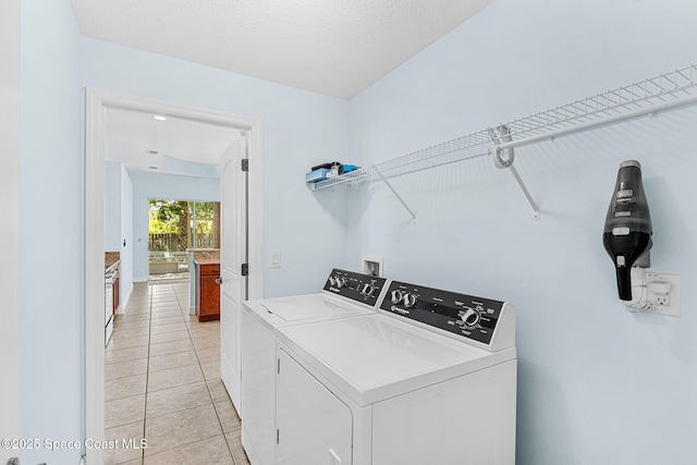 1121 S Orlando Ave, Cocoa Beach, FL 32931 - laundry room featuring independent washer and dryer and light tile patterned flooring