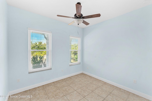 1121 S Orlando Ave, Cocoa Beach, FL 32931 - unfurnished room with plenty of natural light, ceiling fan, and light tile patterned flooring