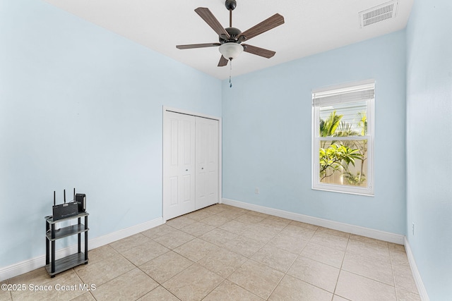 1121 S Orlando Ave, Cocoa Beach, FL 32931 - unfurnished room featuring ceiling fan and light tile patterned floors