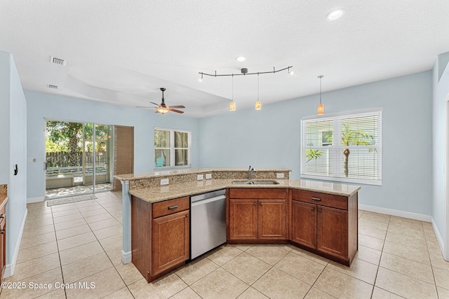 1121 S Orlando Ave, Cocoa Beach, FL 32931 - kitchen with dishwasher, light tile patterned floors, brown cabinetry, ceiling fan, and recessed lighting