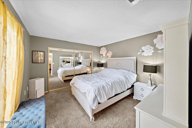 1020 Abada Ct NE Unit 108, Palm Bay, FL 32905 - bedroom featuring light carpet and a textured ceiling