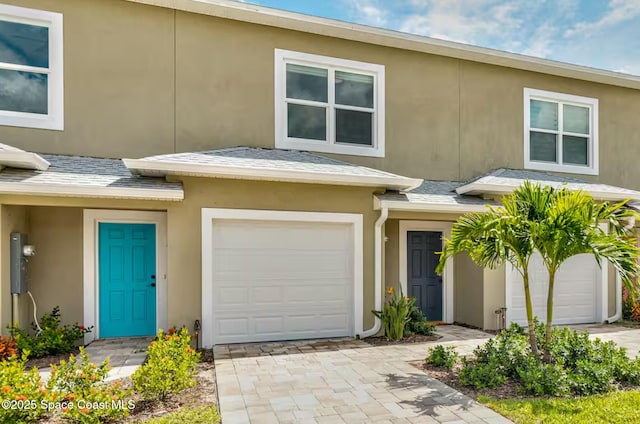 833 Paddleboard Ct, Melbourne, FL 32935 - townhome / multi-family property with stucco siding and a garage