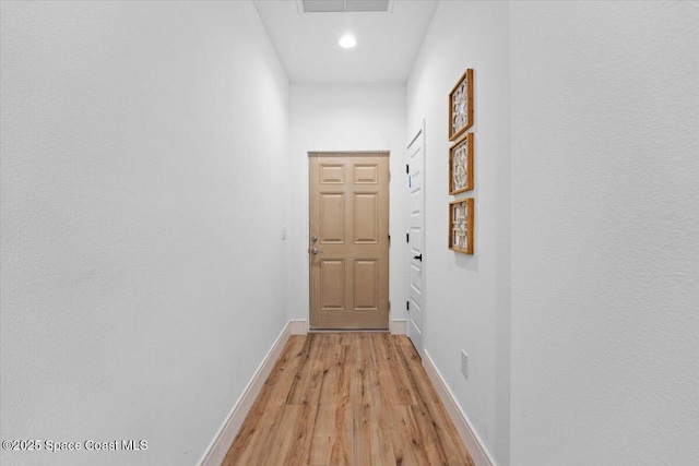 833 Paddleboard Ct, Melbourne, FL 32935 - doorway with light wood-type flooring and recessed lighting
