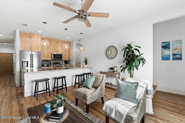 833 Paddleboard Ct, Melbourne, FL 32935 - living area featuring recessed lighting, ceiling fan, and light wood-style flooring