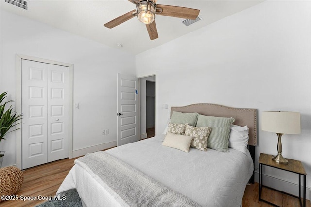 833 Paddleboard Ct, Melbourne, FL 32935 - bedroom featuring wood finished floors, a closet, and a ceiling fan