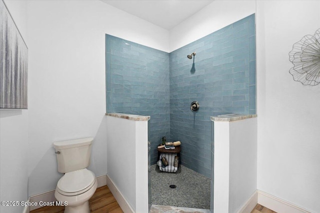 833 Paddleboard Ct, Melbourne, FL 32935 - bathroom featuring walk in shower and wood finished floors