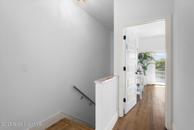 833 Paddleboard Ct, Melbourne, FL 32935 - hall featuring an upstairs landing and wood finished floors
