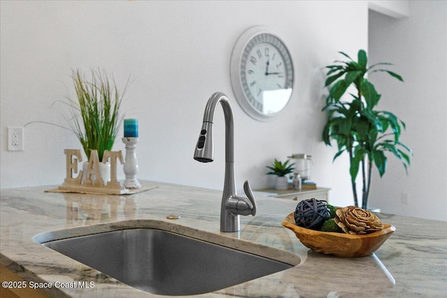833 Paddleboard Ct, Melbourne, FL 32935 - kitchen view of a sink and light stone counters