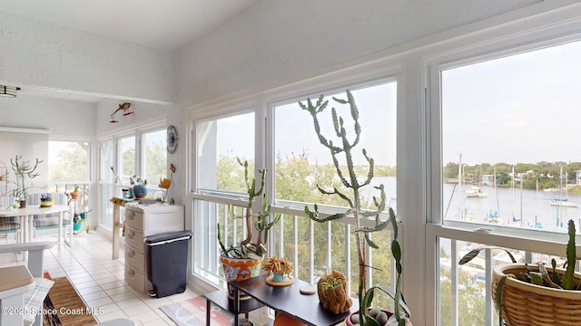 905 N Harbor City Blvd Unit 403, Melbourne, FL 32935 - sunroom featuring a water view and tile patterned flooring