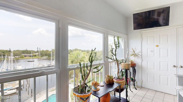 905 N Harbor City Blvd Unit 403, Melbourne, FL 32935 - sunroom featuring tile patterned flooring and a water view