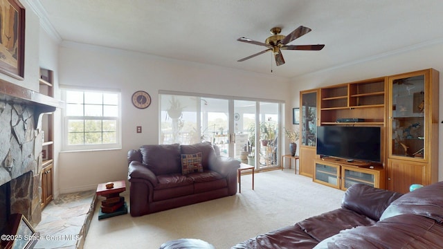 905 N Harbor City Blvd Unit 403, Melbourne, FL 32935 - living room featuring a ceiling fan, ornamental molding, and a fireplace