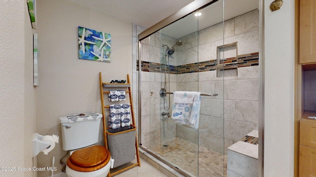 905 N Harbor City Blvd Unit 403, Melbourne, FL 32935 - bathroom featuring toilet and a shower stall