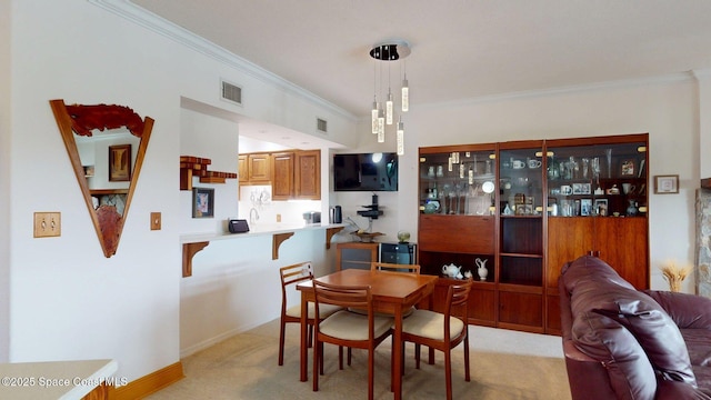 905 N Harbor City Blvd Unit 403, Melbourne, FL 32935 - dining room with light carpet and ornamental molding