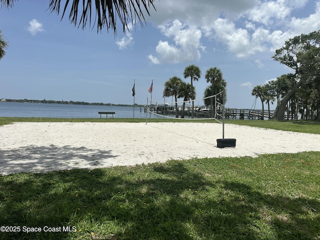 111 Plover Ln Unit 3-35, Rockledge, FL 32955 - view of community with volleyball court, a water view, and a lawn