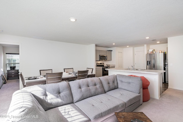 788 Isar Ave NW, Palm Bay, FL 32907 - living area featuring light colored carpet, recessed lighting, and a textured ceiling