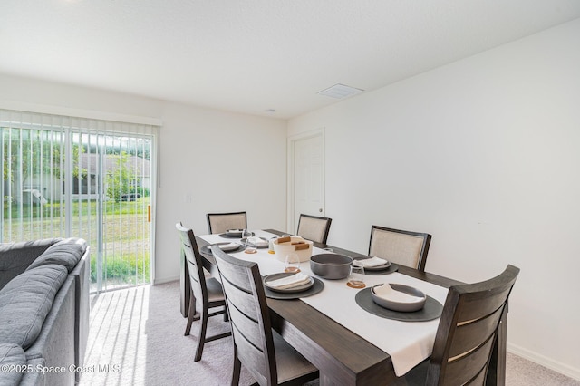 788 Isar Ave NW, Palm Bay, FL 32907 - dining area featuring light colored carpet and baseboards