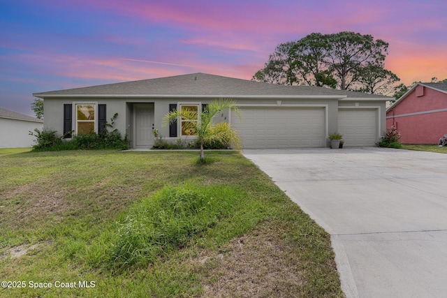 788 Isar Ave NW, Palm Bay, FL 32907 - ranch-style house with an attached garage, driveway, a front lawn, and stucco siding