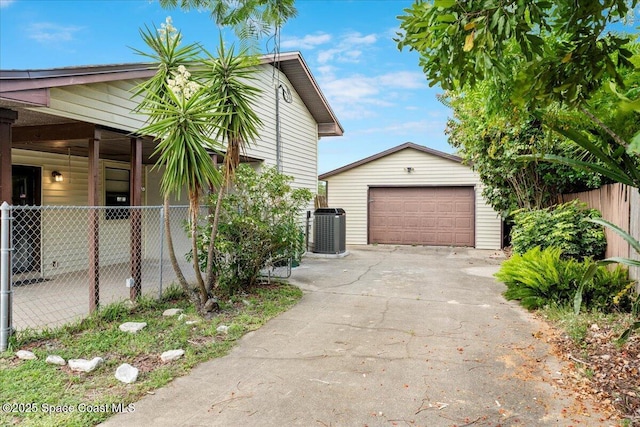 1636 Dixie Way, Melbourne, FL 32935 - view of home's exterior with an outbuilding, a garage, and concrete driveway