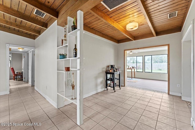 1636 Dixie Way, Melbourne, FL 32935 - tiled spare room with a wood ceiling with exposed beams and baseboards