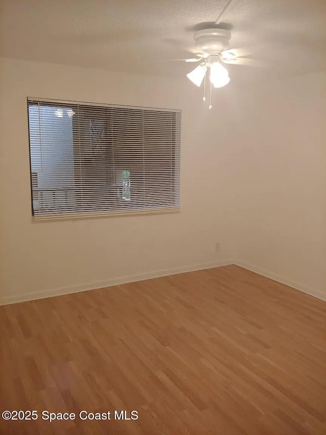 7770 Tahiti Ln Unit 208, Lake Worth, FL 33467 - spare room with wood finished floors and ceiling fan