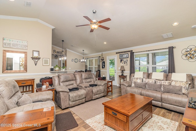 231 Nardo Ave SW, Palm Bay, FL 32908 - living area featuring lofted ceiling, a ceiling fan, light wood-style floors, crown molding, and a chandelier