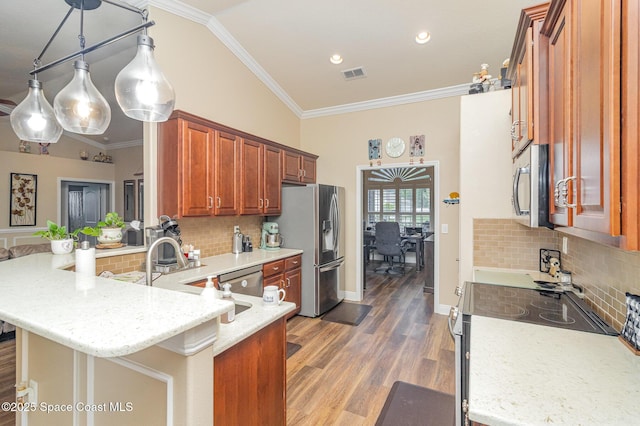 231 Nardo Ave SW, Palm Bay, FL 32908 - kitchen with stainless steel appliances, a peninsula, tasteful backsplash, brown cabinets, and crown molding