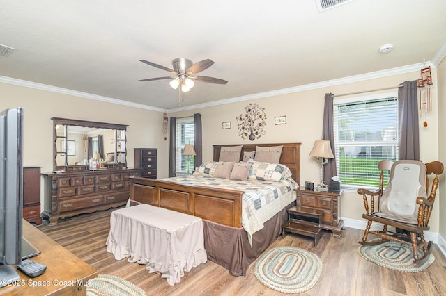 231 Nardo Ave SW, Palm Bay, FL 32908 - bedroom with wood finished floors, crown molding, and a ceiling fan