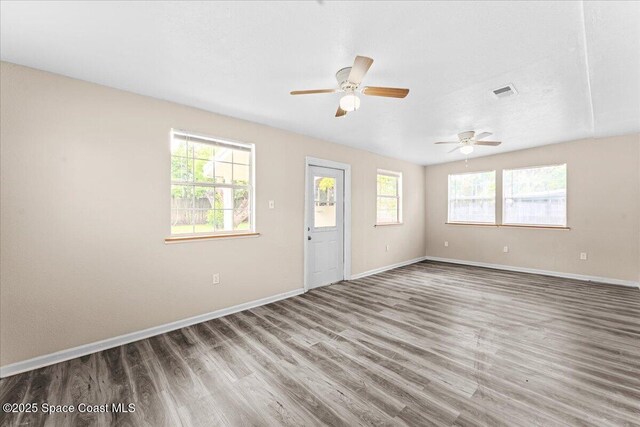 5510 Holden Rd, Cocoa, FL 32927 - unfurnished room featuring wood finished floors and ceiling fan