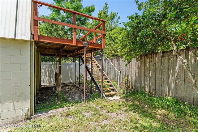 5510 Holden Rd, Cocoa, FL 32927 - fenced backyard with stairs and a wooden deck
