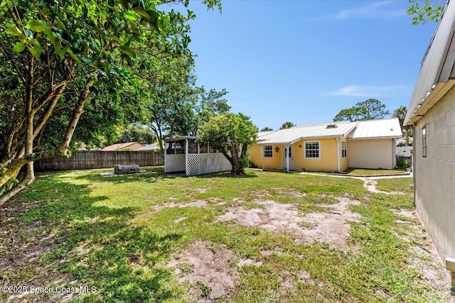 5510 Holden Rd, Cocoa, FL 32927 - fenced backyard with a sunroom